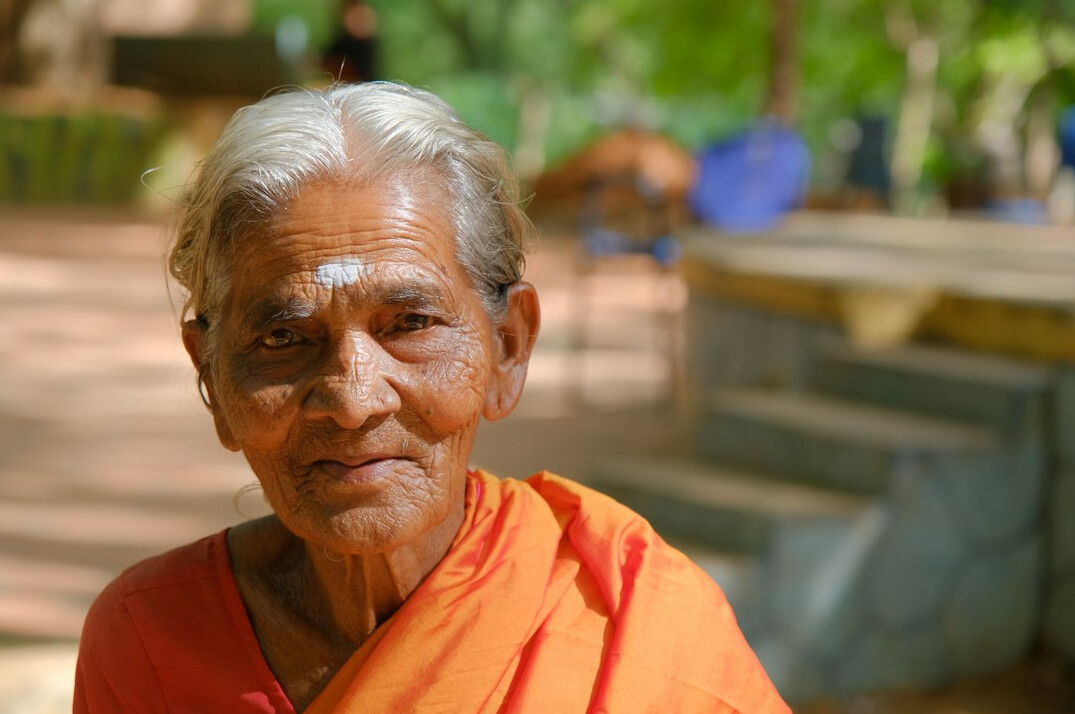 Portrait of a smiling senior woman with short grey hair