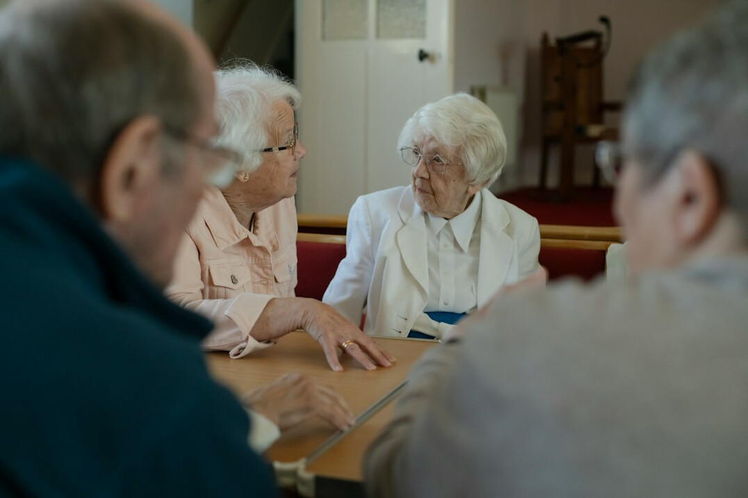 group of elderly friends chatting