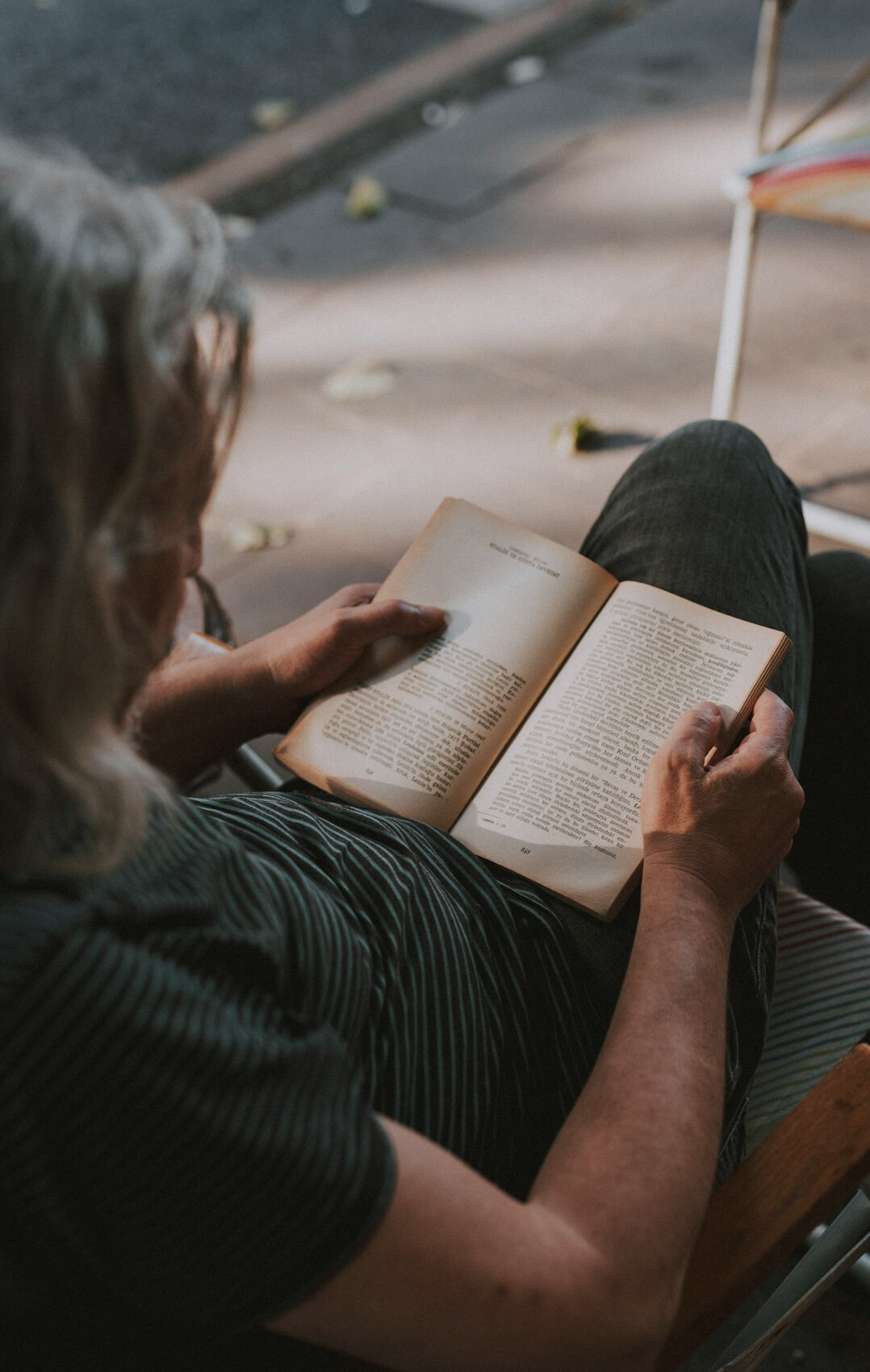elderly man reading book